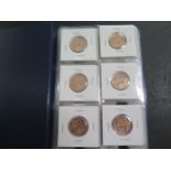 An album of Portugal coins, four sets of coins 50 Centavos 1969-1979, 44 coins