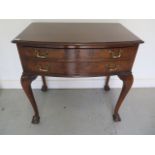 An early 20th century walnut cutlery table with two drawers with compartments - a 12 setting, 79cm