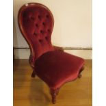 A Victorian button back fireside chair, 89cm tall, seat height 33cm