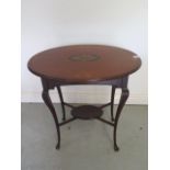 An Art Noveau mahogany inlaid oval side table with an undertier, 70cm tall x 67cm x 49cm, in good