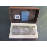An S J Dupont silver plated table lighter, 11cm tall, with box, not tested for working