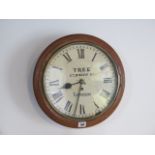 An 8 day oak case 12" dial fusee wall clock, some flaking to dial but in running order