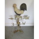 A cast iron weather vane with cockerel to spire, 74cm tall