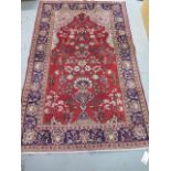 A hand knotted woollen Kashan rug, 2.00m x 1.24m, in good condition