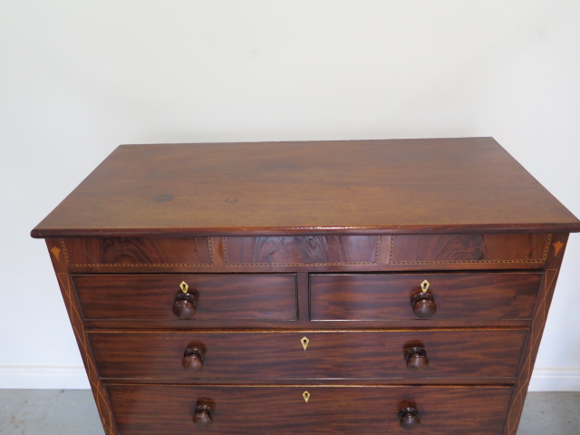 A 19th century mahogany five drawer chest with an inlaid frieze on bracket feet united by a shaped - Image 2 of 6