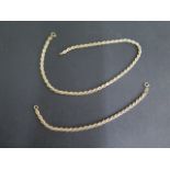 An 18ct yellow gold and white gold necklace, 40cm long, with a matching bracelet 20cm long, both