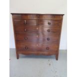 A 19th century mahogany five drawer chest with an inlaid frieze on bracket feet united by a shaped