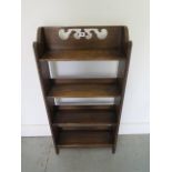 A decorative 1920s oak bookcase, 92cm tall x 46cm x 15cm, in good polished condition