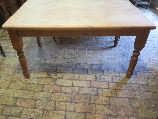 A modern pine kitchen table wit a drawer and screw off legs so it can be used as a coffee table 78