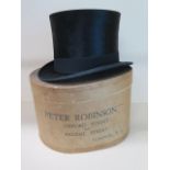 A Christys of London black silk top hat with Peter Robinson box, size approx 7 1/2, measures 16cm