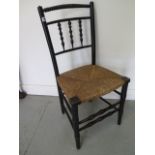 A 19th century William Morris style Sussex Chair, 87cm tall