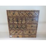 An Oriental parquetry inlaid eight drawer jewellery / collectors chest, 45cm tall x 45cm x 17cm,