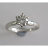 A hallmarked 18ct white gold solitaire diamond ring, approx 0.80ct, ring size O, approx 3.9 grams,