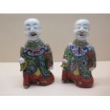 A pair of Chinese 19th / early 20th century wall figures of laughing boys each holding a rui and