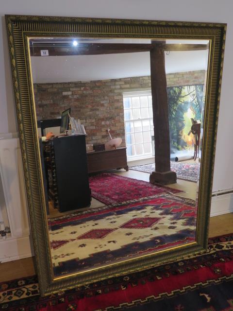 A large gilt framed modern mirror, 137cm x 107cm, in good condition