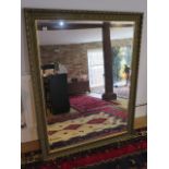 A large gilt framed modern mirror, 137cm x 107cm, in good condition