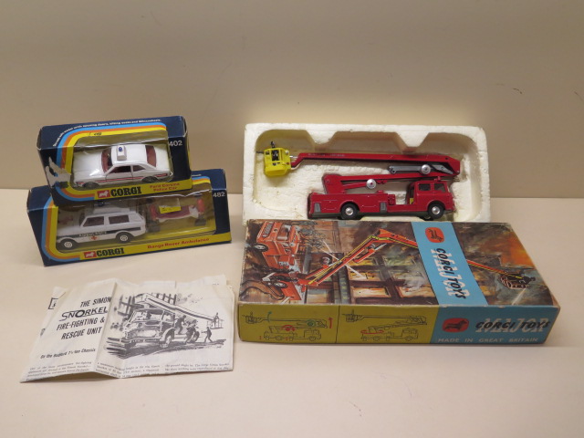 A Corgi Ford Cortina police car, a Corgi Range Rover Ambulance and a Corgi Simon Snorkel fire engine