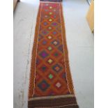 A new hand knotted woollen Suzi Kilim runner, 295 cm x 71 cm