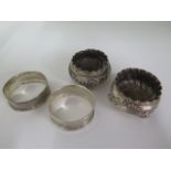 A pair of silver salts and a pair of silver napkin rings, some denting to all, approx 1.6 troy oz