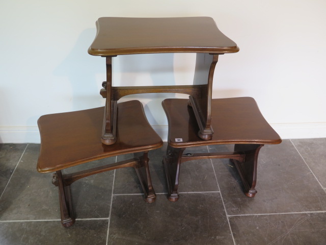 A set of three mahogany tables one with a carved rat, 44cm tall x 53cm x 40cm, all generally good