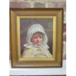 An oil on canvas portrait of a child, monogramed CMA 1890, under glass in a gilt frame, frame size