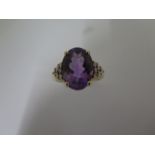 A 9ct yellow gold amethyst and diamond ring, size P 1/2, hallmarked, amethyst approx 14mm x 10mm