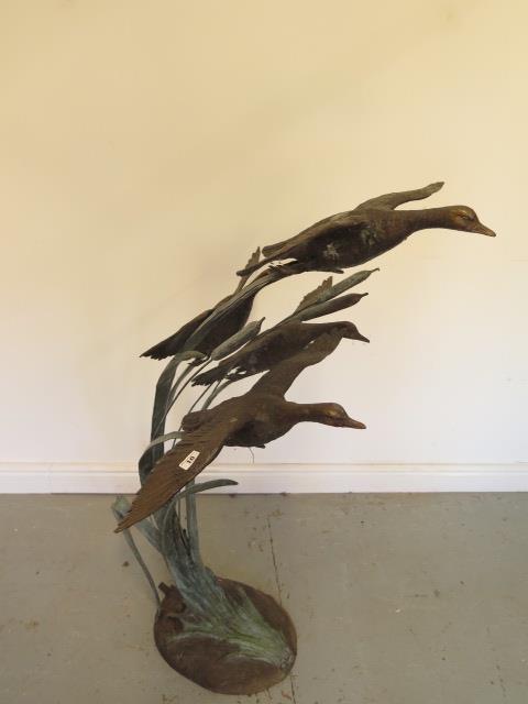 An Escar UK bronze water feature of four ducks in flight amongst the bullrushes, 128cm tall x