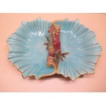 A Majolica centre dish with seaweed handle, 32cm wide no2237, overall crazing and minor chips to