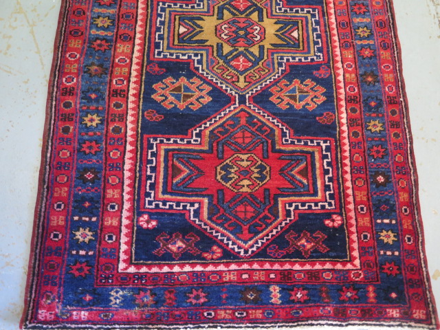 A blue and red ground hand woven runner with a cross door design, some wear but colours bright, - Image 2 of 3