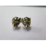 A pair of yellow gold leopard head earrings, backs marked 750, 1cm long, approx 4 grams, good