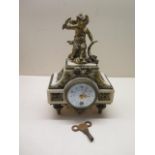 A 19th century French 8 day clock, white marble with brass decorations on four brass tapering