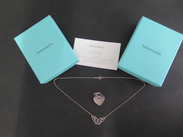 A Tiffany & Co silver heart pendant and a Tiffany butterfly necklace, 40cm long, both with boxes and