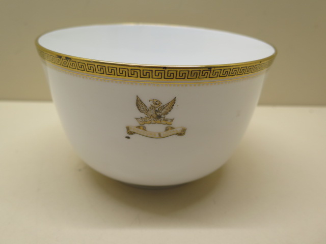 A 19th century Copeland Spode porcelain bowl decorated with a crest and gilded key fret pattern rim,