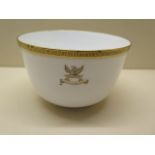 A 19th century Copeland Spode porcelain bowl decorated with a crest and gilded key fret pattern rim,