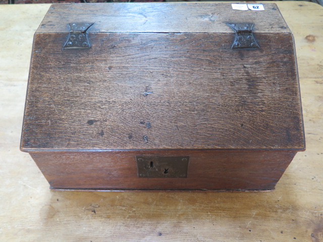 A 19th century oak clerks box with a sloping front and three internal drawers, 27cm tall x 49cm x