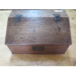 A 19th century oak clerks box with a sloping front and three internal drawers, 27cm tall x 49cm x