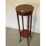 An Edwardian mahogany plant stand, 94cm tall x 30cm diameter