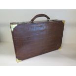 A good quality early 20th century crocodile travelling correspondence attache case in restored