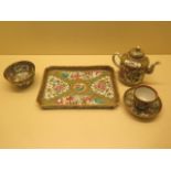 A matched famille rose Canton bachelors part tea set on tray, teapot with associated top otherwise