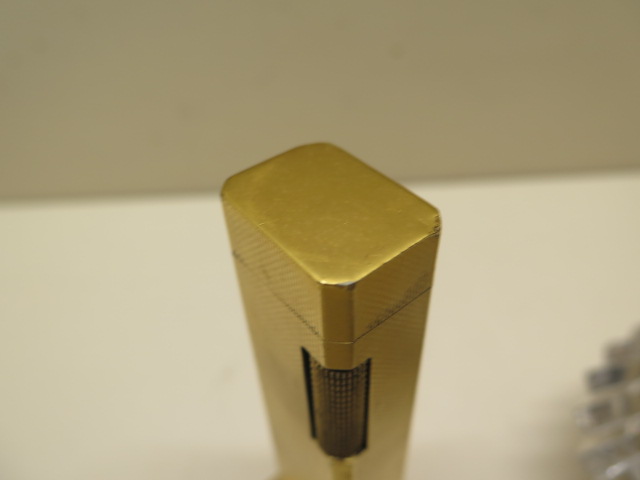 A Dunhill tallboy gold plated table lighter, 11cm tall, and two Ronson table lighters, some - Image 2 of 5