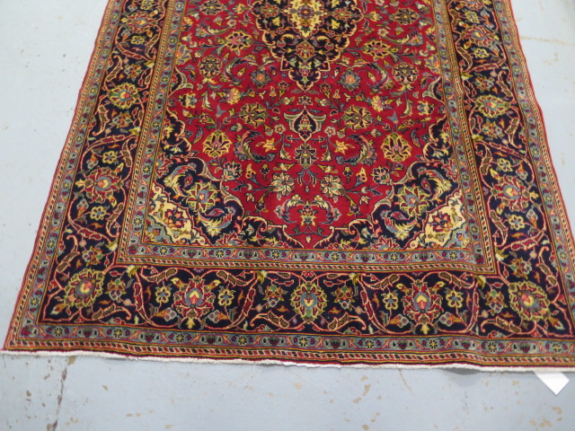 A hand knotted woollen fine Kashan rug, 2.20m x 1.35m, in good condition - Image 2 of 4