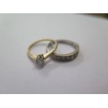 An 18ct yellow gold solitaire ring and an 18ct white gold ring, sizes K and L, total weight approx