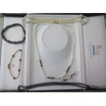 Three single string pearl necklaces, 42cm and 44 cm, one with a 9ct gold clasp the others with