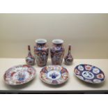 Two pairs of Imari vases, tallest 22cm and three Imari plates, all generally good minor chips to