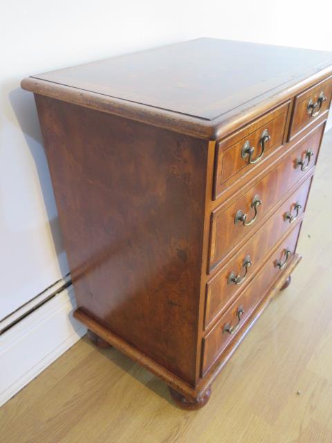 A yew oyster veneer chest of small proportions with two short over three long drawers on turned feet - Image 3 of 5