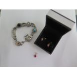 A 10K gold pendant and earring set, approx 0.7 grams and a silver charm bracelet, approx 18.8 grams