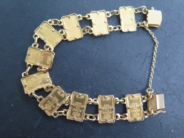 A gold bracelet set with 10 Suisse 1g 999.9 fine gold ingots, bracelet tests to approx 18ct, total - Image 2 of 2