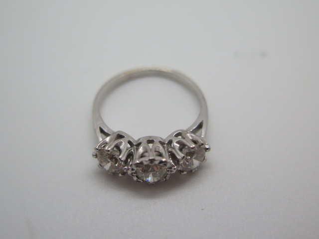 A hallmarked 18ct white gold three stone diamond ring, the outer diamonds approx 0.55ct each, the - Image 4 of 6