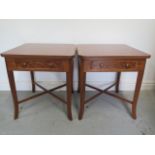 A pair of burr wood veneer lamp tables each with a drawer on splayed legs united by cross