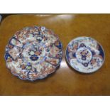 A large Japanese Imari fluted charger, 46cm diameter, and a smaller dished plate, 30cm diameter,